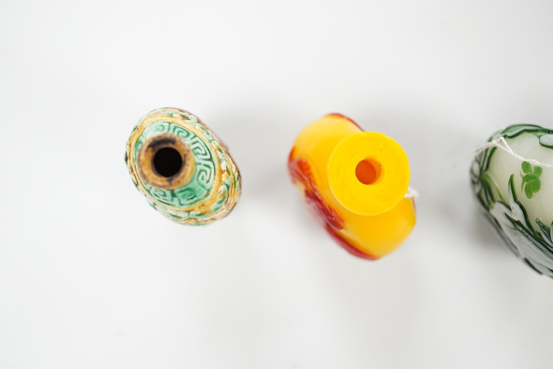 Three Chinese glass snuff bottles and a porcelain snuff bottle(4), tallest 8cm high